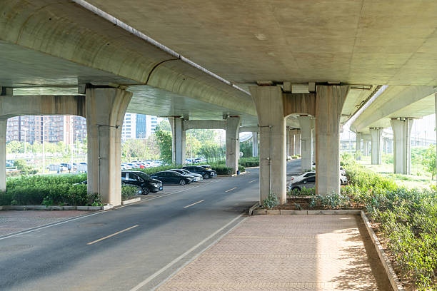 istock Concrete structure and asphalt road space under the overpass in the city 2219109378
