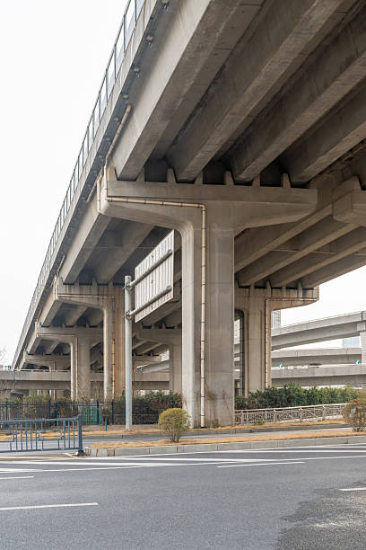 istock Concrete structure and asphalt road space under the overpass in the city 2219111598