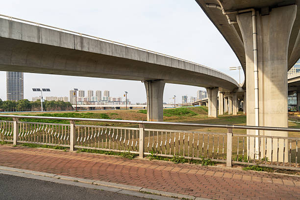 istock Concrete structure and asphalt road space under the overpass in the city 2219112278