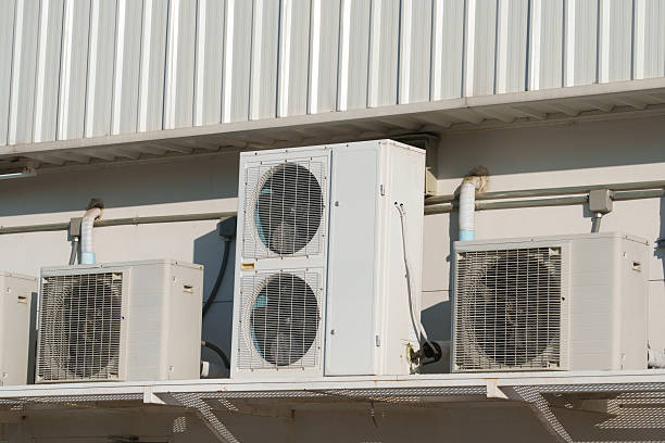 istock Air compressor or air condenser unit located on support outside building to heat released transferred to surrounding environment, Compressor is part of cooling function and air conditioning HVAC syste 2219119812