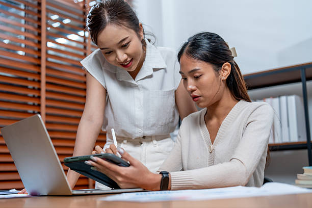 istock Collaborative planning in modern office setting showcases two women engaged in marketing strategies. focus on cosmetic packaging highlights their teamwork and creativity 2219119886