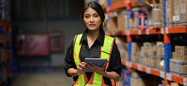 istock Warehouse worker working and checking the stock in the warehouse. .Factory manager using digital tablet check barcode in industry factory logistic. 2219120493