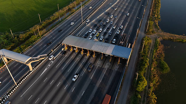 istock A highway where cars are paying tolls. 2219120693