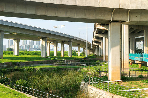 istock Concrete structure and asphalt road space under the overpass in the city 2219125576