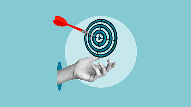 istock Set your goals is shown using the collage with aim and the hand. Business targeting, aiming, focus concept 2219127139