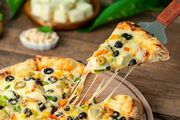 istock Italian pizza with mozzarella cheese close-up pizza slice 2219129565