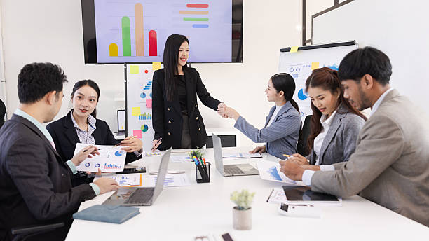 istock Group of business people handshake and working together with dashboard analysis and data management in meeting room. 2219132506