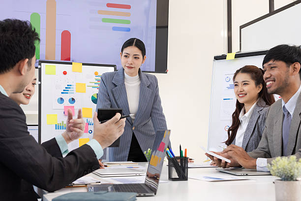 istock Group of business people working together with dashboard analysis and data management in meeting room. 2219132555