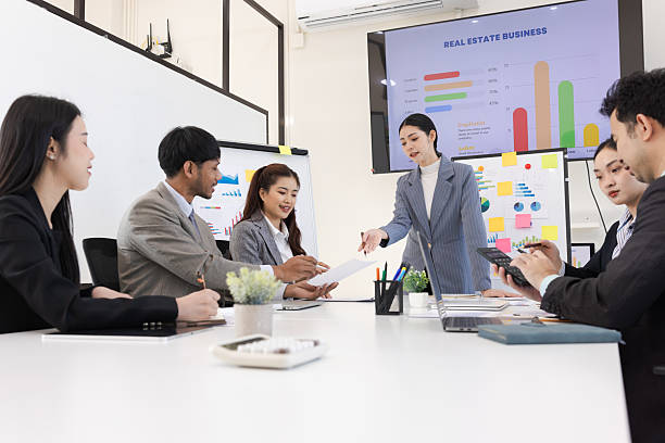 istock Group of business people working together with dashboard analysis and data management in meeting room. 2219132559