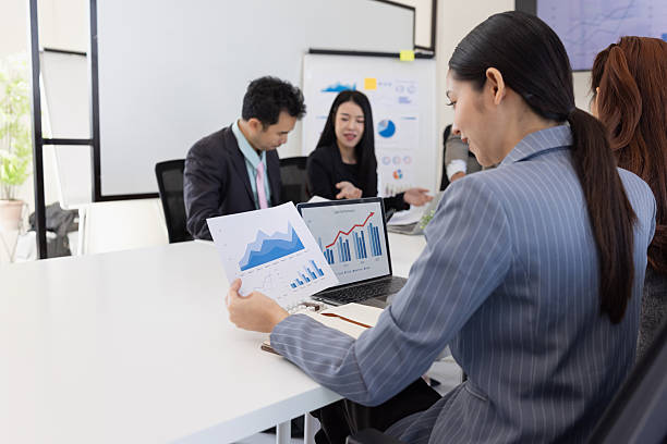istock Group of business people working together with dashboard analysis and data management in meeting room. 2219134183