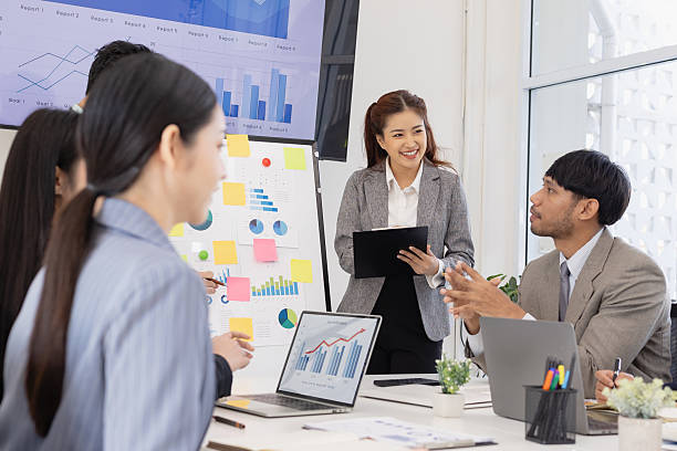 istock Group of business people working together with dashboard analysis and data management in meeting room. 2219134206