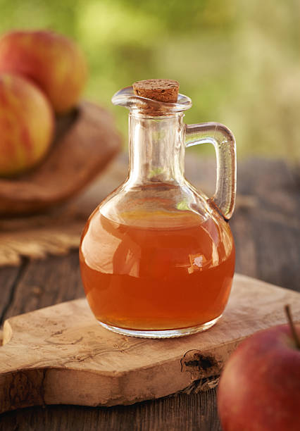 istock Apple cider vinegar in a glass jug 2219134573