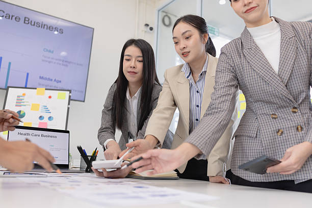 istock Group of businesspeople working plan analysis project brainstorm in modern office 2219134684
