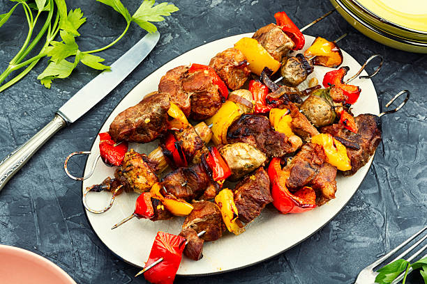 istock Skewers with grilled meat and vegetables. 2219135751