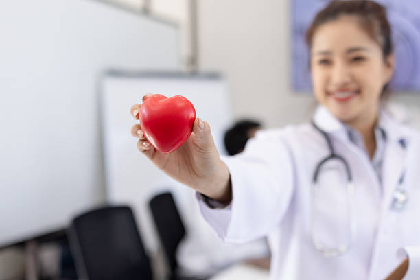 istock Female doctor holding a red heart. 2219135960