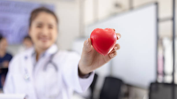 istock Female doctor holding a red heart. 2219135973