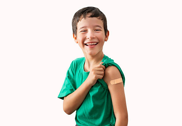 istock Happy child with plaster after vaccination 2219138308