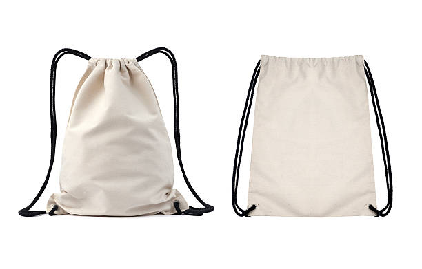 istock Cotton canvas burlap bag with drawstring. Mock up isolated. Zero waste concept.  Eco sack made from natural cotton fabric cloth. 2219139041