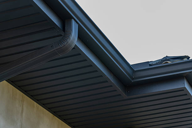 istock Unique metallic roof design features sleek tiles and efficient guttering, showcasing modern roofing techniques in residential architecture 2219139232