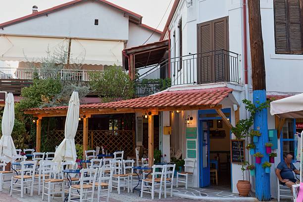 istock An outdoor restaurant with white chairs and tables 2219142041