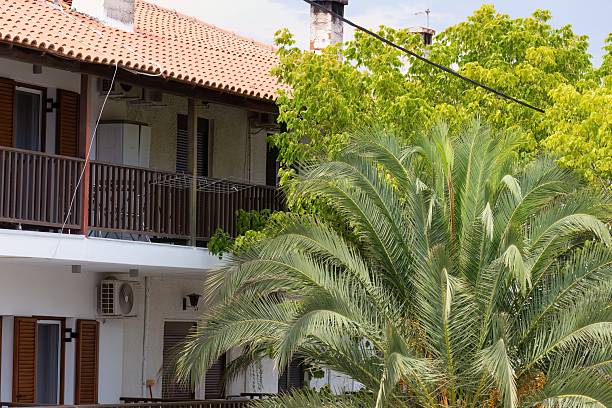 istock A two-story building with a red tile roof. 2219142169