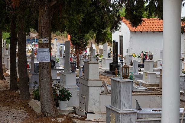 istock A cemetery with various tombstones and greenery. 2219142263
