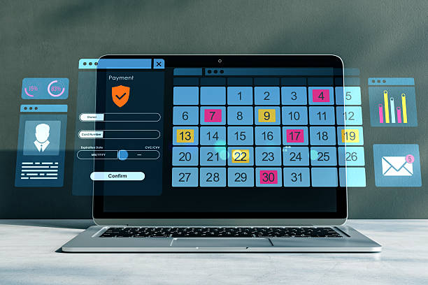 istock Digital calendar interface on laptop with payment form and data charts over gray background, representing online scheduling and finance concept. 3D Rendering 2219142958
