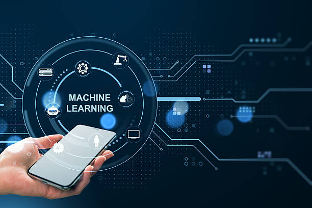 istock Smartphone in hand displaying machine learning interface with futuristic tech icons and neural network data flow on dark digital background. 2219143102