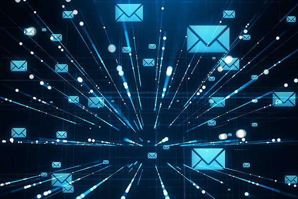 istock Digital email communication concept with glowing envelope icons and light rays on a futuristic blue background representing virtual inboxes. 3D Rendering 2219143134