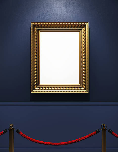 istock Empty golden frame hanging on dark blue museum wall with red velvet barrier in front, creating a classic art gallery interior scene. 3D Rendering 2219143904