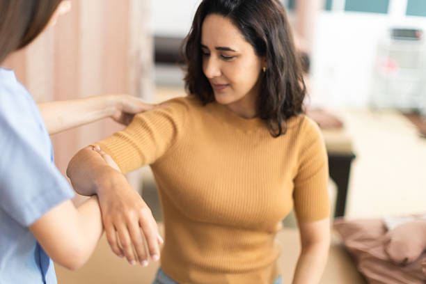 istock Physical therapist working with patient.Passive movement exercises for upper extremity .Doctor consulting with patient arm problems Physical therapy concept. 2219147246