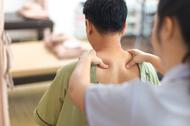 istock Physical therapist working with patient.Passive movement exercises for upper extremity .Doctor consulting with patient arm problems Physical therapy concept. 2219147401