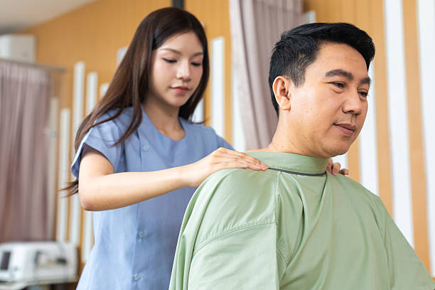 istock Physical therapist working with patient.Passive movement exercises for upper extremity .Doctor consulting with patient arm problems Physical therapy concept. 2219147430
