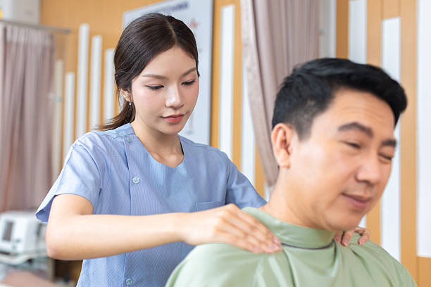 istock Physical therapist working with patient.Passive movement exercises for upper extremity .Doctor consulting with patient arm problems Physical therapy concept. 2219147454