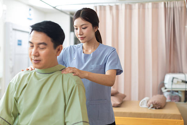 istock Physical therapist working with patient.Passive movement exercises for upper extremity .Doctor consulting with patient arm problems Physical therapy concept. 2219147477