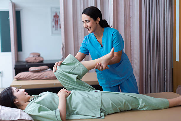 istock Physical therapist working with patient.Passive movement with stretching exercises for lower extremity .Doctor consulting with patient Knee or leg  problems Physical therapy concept. 2219149477