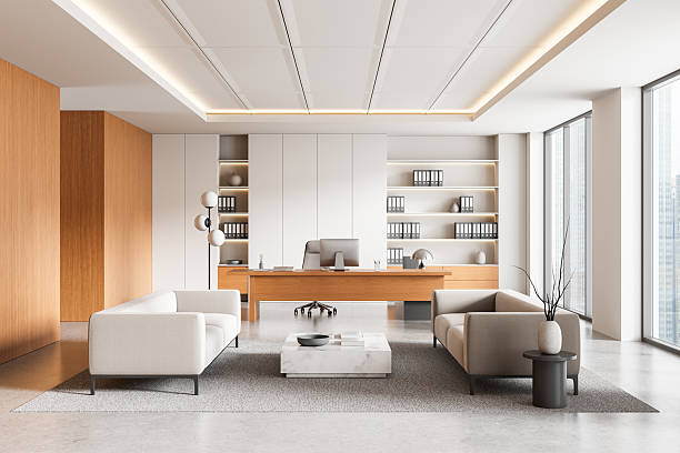 istock Modern executive office interior with minimalist furniture, large windows, and wooden elements in a bright corporate environment. 3D Rendering 2219153410