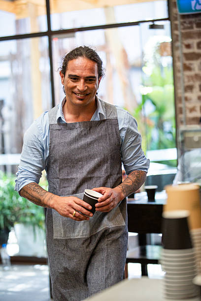 istock Male waiter serves customers 2219153735