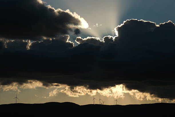 Silhouetted Wind Turbines on a Hill Against Bursa's Dramatic Sunset Sky