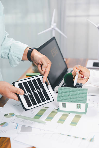istock Business people working on sustainable innovation project. renewable energy concept. Teamwork Meeting, partner on model building company office technology, based green businesses and global warming. 2219156608