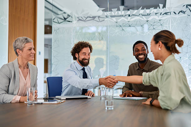 istock Business partners shaking hands during a meeting in the office 2219159157
