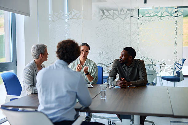 istock Business team discussing during a meeting in a modern office 2219159321
