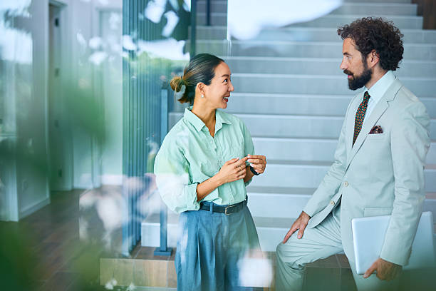 istock Businesspeople chatting during a break in the office 2219159541