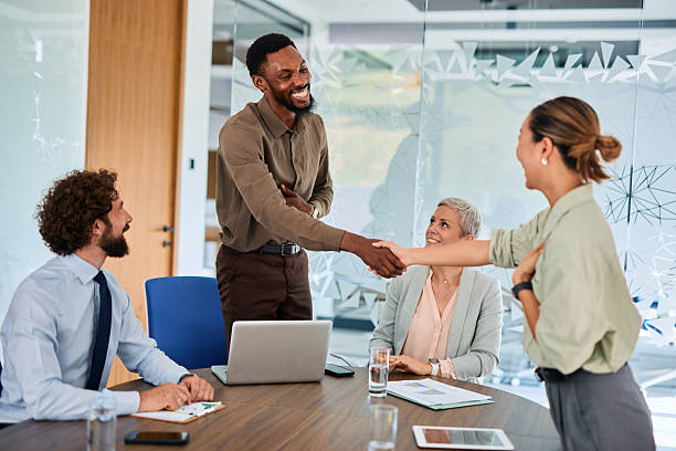 istock Business team shaking hands during a meeting in the office 2219159830