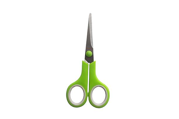 istock School scissors closed, green handle isolated on white background. School stationery 2219161683