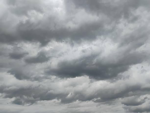 istock Dark and grey cumulative clouds visible at the afternoon sky 2219163405