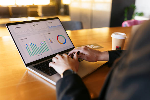 istock Businesswoman analyzing financial data on laptop in modern office 2219166456