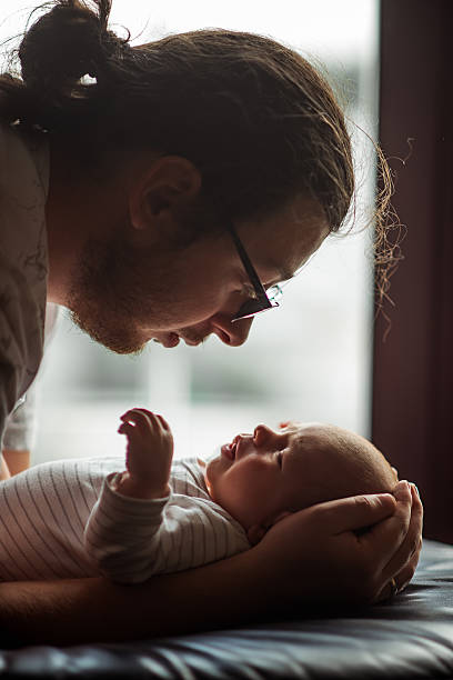 istock Father Bonding with Newborn in Tender Moment 2219166978