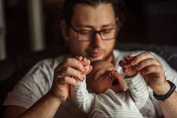istock Father Bonding with Newborn Baby at Home 2219167161