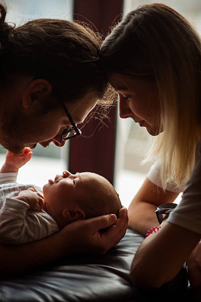 istock Loving Parents Bonding with Newborn Baby 2219167297